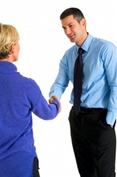 two people shaking hands in a formal situation
